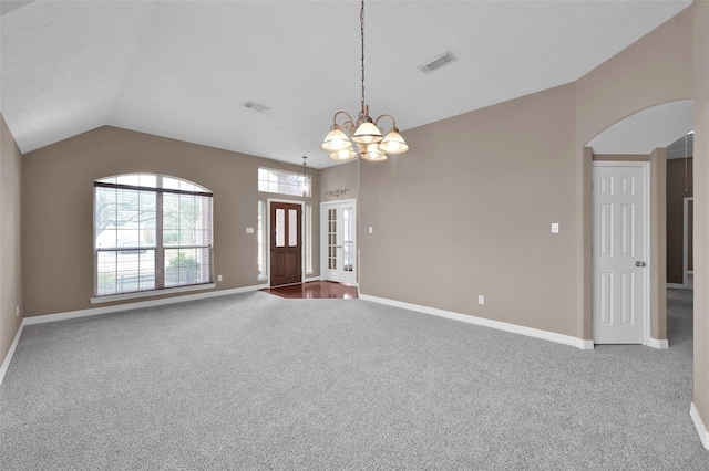 interior space with carpet flooring, baseboards, a chandelier, and lofted ceiling