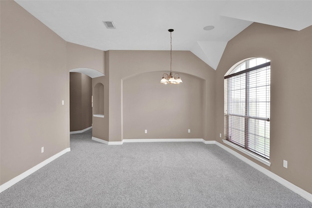 unfurnished room featuring an inviting chandelier, arched walkways, carpet, baseboards, and visible vents