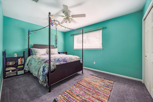 bedroom with ceiling fan, baseboards, carpet, and a closet