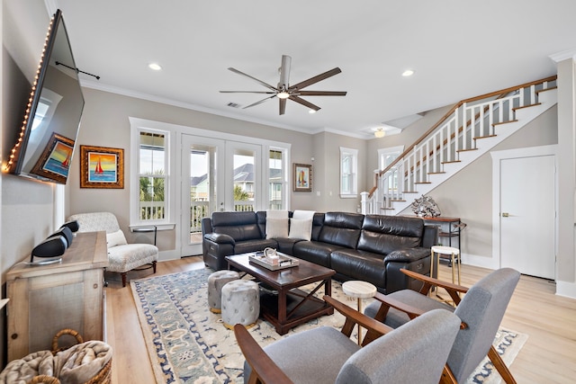 4014 Miramar Ct, Galveston, TX 77554 - living area featuring ornamental molding, light wood-type flooring, a ceiling fan, and stairs