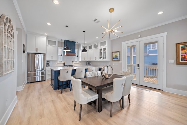 4014 Miramar Ct, Galveston, TX 77554 - dining area with visible vents, crown molding, baseboards, light wood-style floors, and recessed lighting