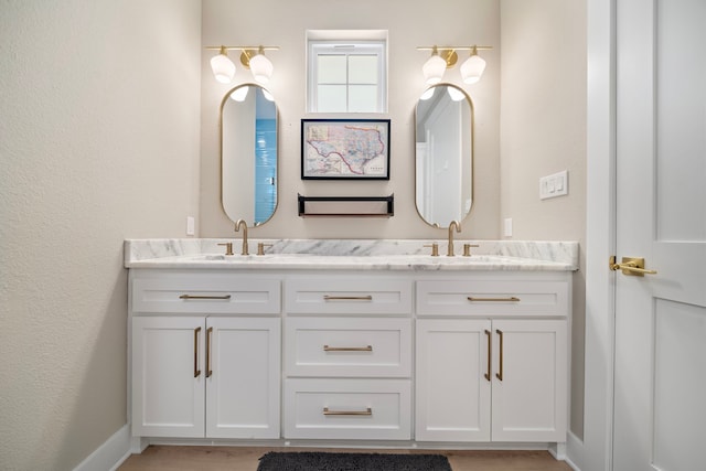 4014 Miramar Ct, Galveston, TX 77554 - full bathroom featuring a sink, baseboards, and double vanity