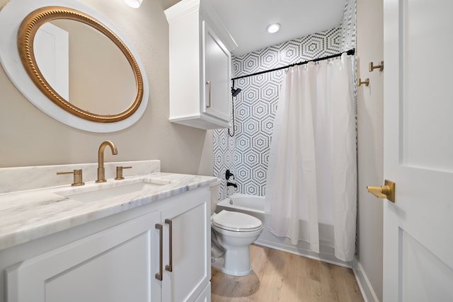4014 Miramar Ct, Galveston, TX 77554 - bathroom featuring vanity, wood finished floors, toilet, recessed lighting, and shower / bath combo