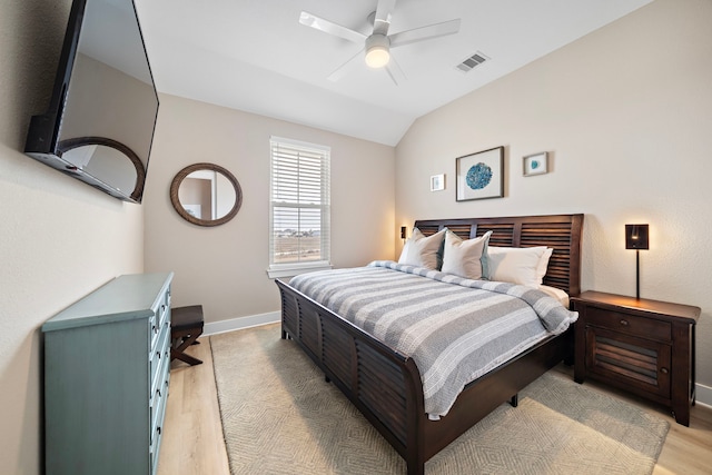 4014 Miramar Ct, Galveston, TX 77554 - bedroom featuring visible vents, baseboards, light wood-type flooring, a ceiling fan, and vaulted ceiling