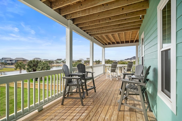 4014 Miramar Ct, Galveston, TX 77554 - wooden terrace featuring a yard, a water view, and a residential view