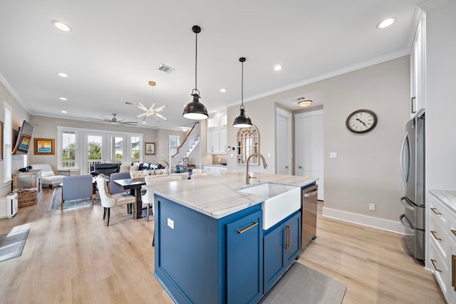 4014 Miramar Ct, Galveston, TX 77554 - kitchen featuring crown molding, appliances with stainless steel finishes, a sink, recessed lighting, and blue cabinets