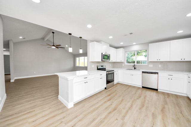 16315 Summer Dew Ln, Houston, TX 77095 - kitchen featuring stainless steel appliances, a sink, light wood-style flooring, decorative backsplash, and recessed lighting