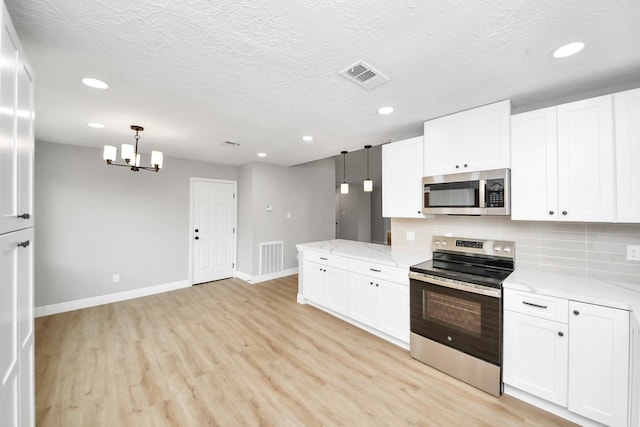16315 Summer Dew Ln, Houston, TX 77095 - kitchen featuring stainless steel appliances, baseboards, light wood finished floors, backsplash, and white cabinetry
