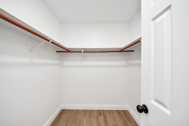 16315 Summer Dew Ln, Houston, TX 77095 - spacious closet featuring wood finished floors