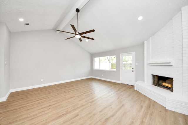 16315 Summer Dew Ln, Houston, TX 77095 - unfurnished living room featuring a ceiling fan, a brick fireplace, light wood-style floors, baseboards, and recessed lighting