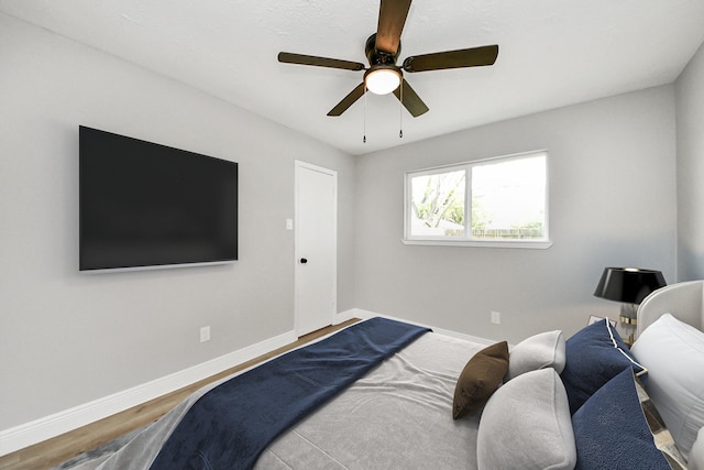 16315 Summer Dew Ln, Houston, TX 77095 - bedroom with baseboards, wood finished floors, and ceiling fan