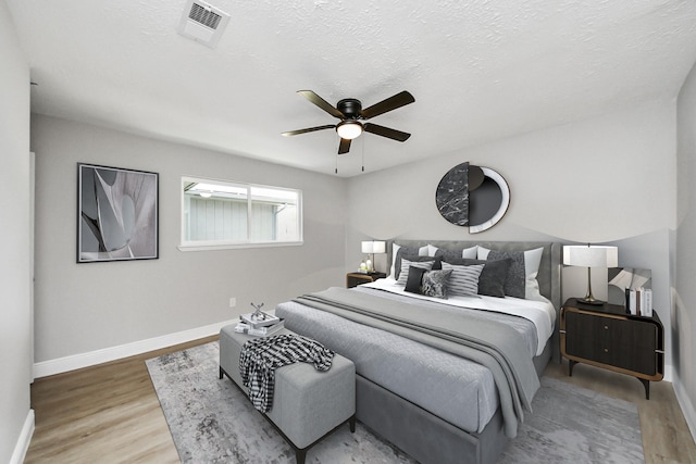 16315 Summer Dew Ln, Houston, TX 77095 - bedroom featuring wood finished floors, baseboards, and a ceiling fan