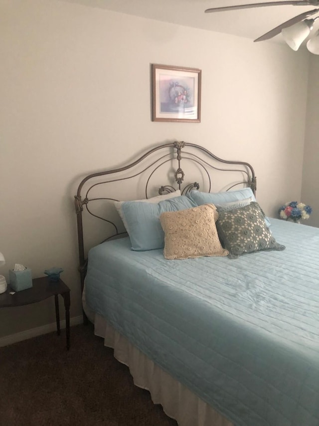 carpeted bedroom featuring a ceiling fan