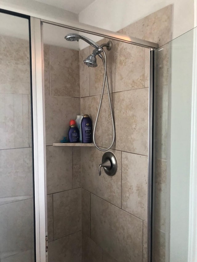 bathroom with a shower stall
