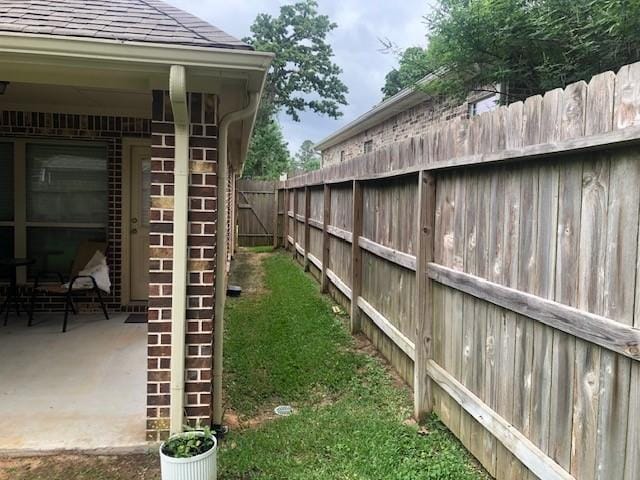 view of yard featuring fence and stairs