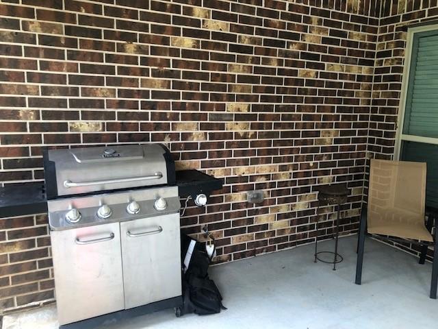 exterior details featuring brick siding