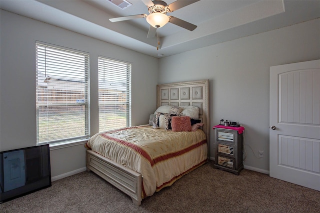 bedroom with carpet floors, baseboards, and visible vents