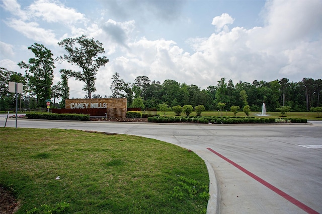 view of street with traffic signs and curbs