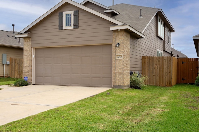 view of front of house with fence, concrete driveway, a front lawn, and brick siding