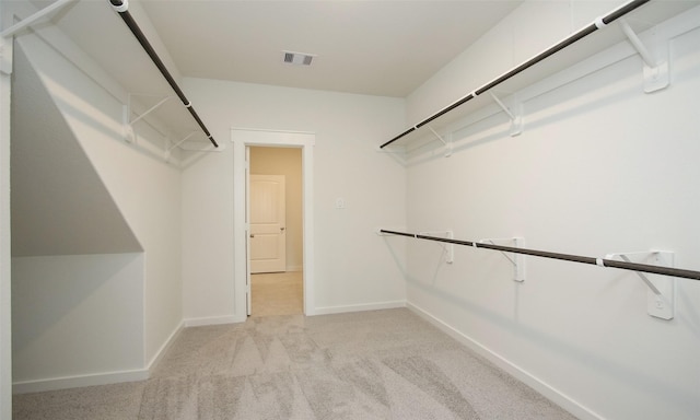 4439 Azalea Blossom Rd, Pinehurst, TX 77362 - walk in closet featuring light colored carpet and visible vents