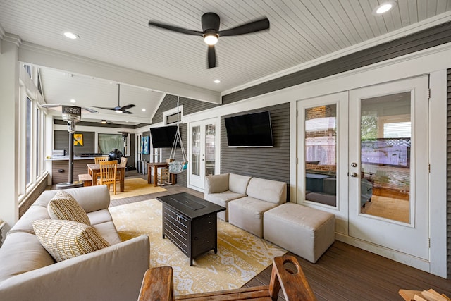 living area with a ceiling fan, french doors, wood finished floors, and wood ceiling