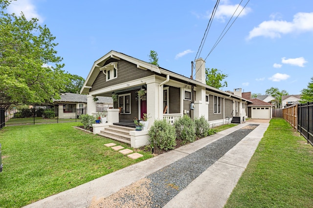bungalow-style house featuring a porch, a chimney, a front yard, fence, and concrete driveway