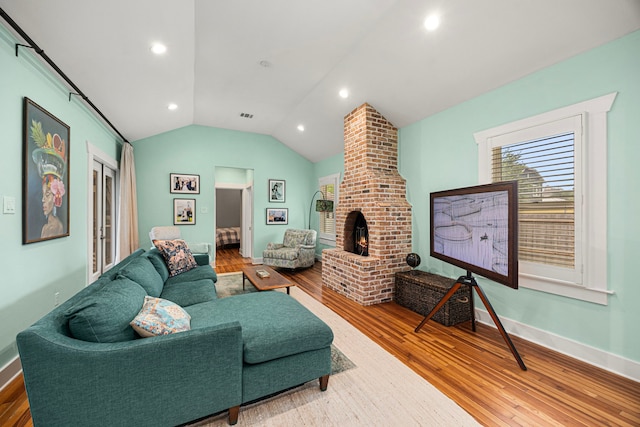 living room featuring visible vents, wood finished floors, baseboards, recessed lighting, and vaulted ceiling