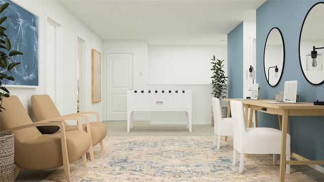 living area featuring baseboards