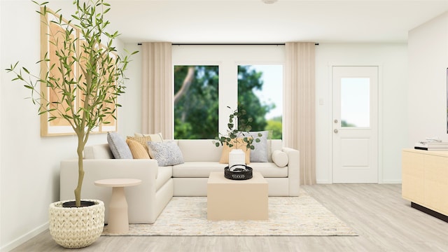 sitting room with baseboards and wood finished floors