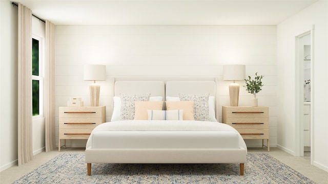 bedroom with baseboards and carpet