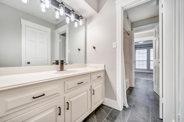 bathroom featuring vanity, baseboards, and a shower with curtain