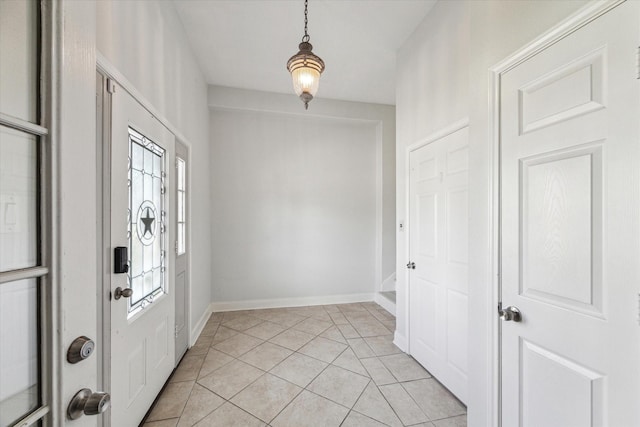 138 Isles End Rd, Tiki Island, TX 77554 - entrance foyer with light tile patterned floors and baseboards