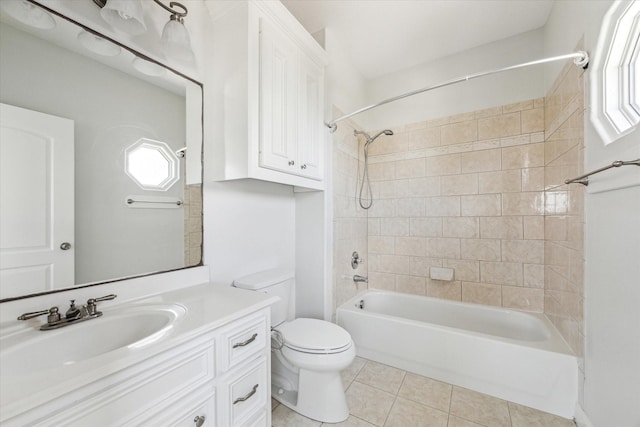 138 Isles End Rd, Tiki Island, TX 77554 - full bath with tile patterned flooring, plenty of natural light, toilet, and shower / bathtub combination