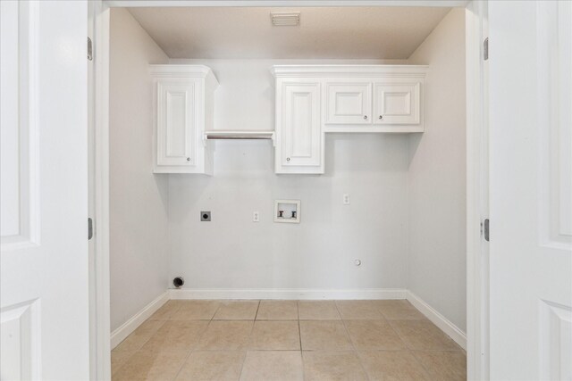 138 Isles End Rd, Tiki Island, TX 77554 - laundry area with gas dryer hookup, hookup for an electric dryer, baseboards, hookup for a washing machine, and light tile patterned floors