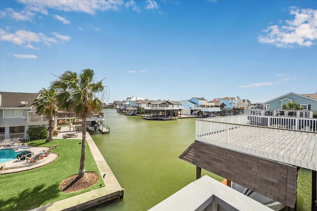 138 Isles End Rd, Tiki Island, TX 77554 - dock area with a residential view, a water view, and a lawn