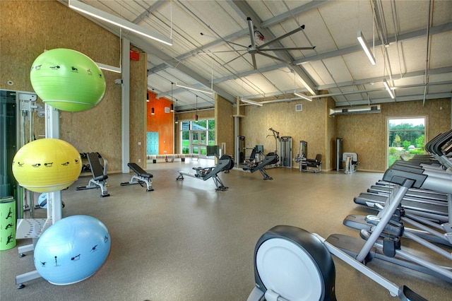 workout area with high vaulted ceiling and a wealth of natural light