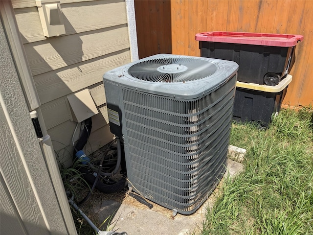 exterior details featuring a dry bar and central AC unit
