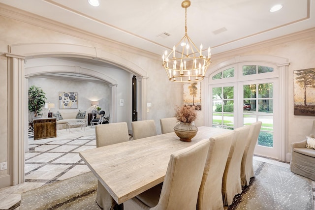dining room featuring decorative columns, visible vents, arched walkways, a chandelier, and recessed lighting