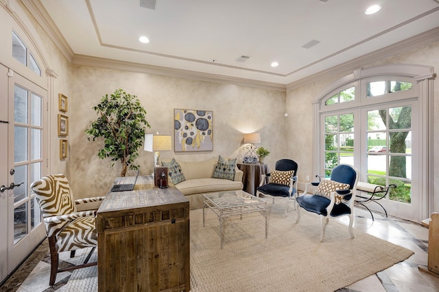 living room featuring french doors, ornamental molding, and recessed lighting