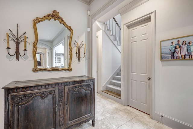 hall with crown molding and stairs