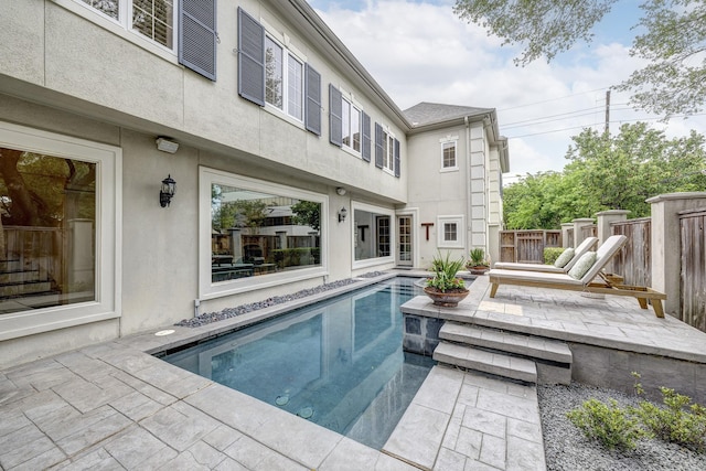 view of swimming pool with fence, a patio area, and a fenced in pool