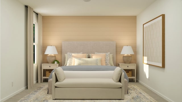 carpeted bedroom featuring baseboards