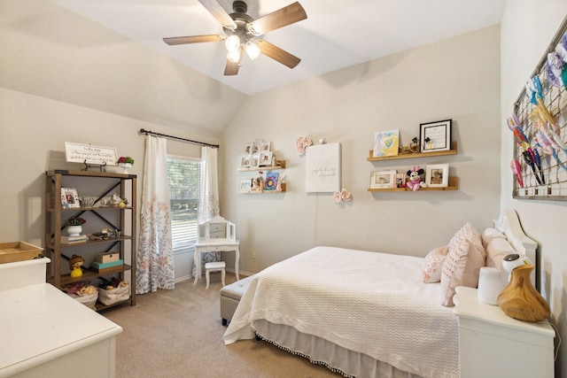 bedroom with a ceiling fan, light carpet, and vaulted ceiling