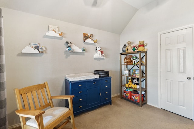 living area with lofted ceiling and light carpet