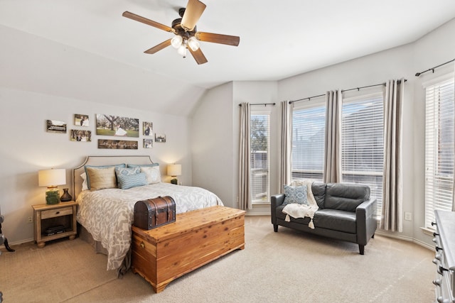 bedroom with baseboards, ceiling fan, and light carpet