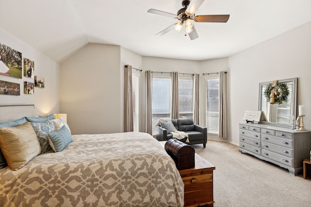 bedroom featuring vaulted ceiling, carpet floors, and a ceiling fan