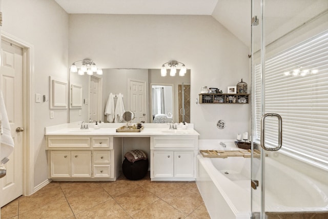 full bath featuring a sink, double vanity, tile patterned floors, a shower with door, and a garden tub