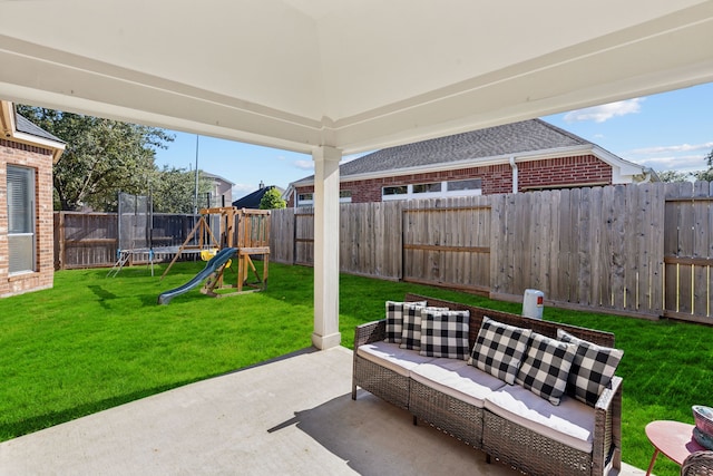 view of patio / terrace with a fenced backyard, a trampoline, a playground, and outdoor lounge area