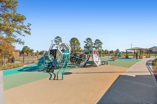 community playground featuring fence and a gazebo