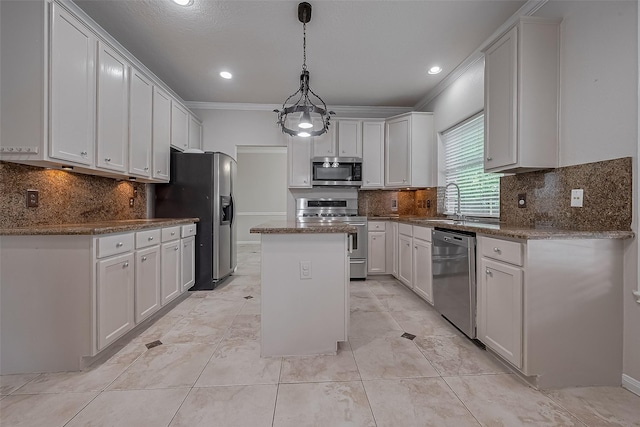 10310 Sable Trail Ln, Houston, TX 77064 - kitchen featuring appliances with stainless steel finishes, a kitchen island, backsplash, a sink, and crown molding